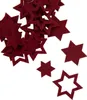 A pile of red felt stars on a white background. Produktbild-Vorschau