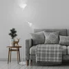 A floor lamp and a sofa in a living room setting. Produktbild-Vorschau