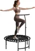 A woman is exercising on a mini trampoline with a handle. Produktbild-Vorschau