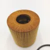 A close-up, studio shot of a car oil filter. Voir les images du produit