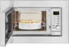 A built-in microwave oven with the door open, showing a white ceramic dish with food inside. Produktbild-Vorschau