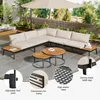 An outdoor patio scene featuring a sectional sofa set with coffee tables and an umbrella. Náhled obrázku produktu