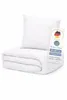 A folded duvet and a pillow are displayed on a white background, with a product tag attached. Produktbild-Vorschau
