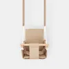 A baby swing is shown hanging against a plain background. Produktbild-Vorschau