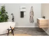 A modern bathroom with a freestanding bathtub, a vanity, and a towel warmer. Náhľad obrázku produktu
