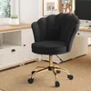 A black office chair with a gold base is shown in a home office setting. Voir les images du produit