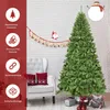 A Christmas tree is shown in a room with a chair and decorations. Produktbild-Vorschau