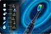 A dark blue electric toothbrush with a multi-colored brush head is shown against a dark, starry background with glowing blue rings. To the left, a vertical display shows different brushing modes with icons and text. Náhled obrázku produktu