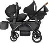 A black double stroller with two car seats attached, shown from the side. Voir les images du produit