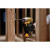 A person is using a DeWalt cordless drill to screw into a wooden beam. Produktbild-Vorschau