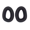 Two black ear pads for headphones are shown against a white background. Voir les images du produit
