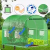 A green tunnel greenhouse with plants inside, set up on a grassy lawn. Produktbild-Vorschau