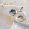 A close-up view of a gray curtain with a gold marble pattern and grommets. A portion of text is visible underneath the curtain. Produktbild-Vorschau