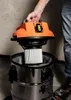 A person is holding the top part of a wet/dry vacuum cleaner, showing the filter inside, over the main body of the vacuum. Podgląd zdjęcia produktu