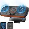 A Bluetooth speaker with a sun visor clip, shown with two smartphone screens displaying music and call interfaces. Produktbild-Vorschau