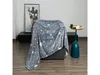 A gray blanket with white stars is draped over a sofa in a room with a painting on the wall and a side table with a vase and a book. Anteprima dell’immagine prodotto
