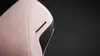 A close-up of a pink gaming chair with black mesh accents. Náhľad obrázku produktu