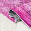 A close-up view of a rolled-up rug showing its textured surface and underside. Náhled obrázku produktu