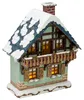 Ein charmantes Miniaturhaus mit schneebedecktem Dach und beleuchteten Fenstern strahlt Gemütlichkeit aus und erinnert an eine winterliche Szenerie in einem verschneiten Dorf Produktbild-Vorschau