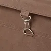 A close-up of a metal clasp and ring attached to a brown fabric bag. Anteprima dell’immagine prodotto