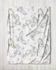 A white blanket with a repeating pattern of cartoon owls and golden stars. Produktbild-Vorschau