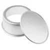 A silver round cake pan with its lid slightly ajar, shown on a white background. Produktbild-Vorschau