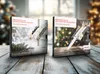 Two advent calendars with knives on a wooden table, with a Christmas tree in the background. Náhled obrázku produktu