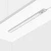 A linear LED light fixture is shown mounted on a white ceiling. Produktbild-Vorschau