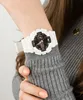 A close-up shot of a person's arm wearing a white Casio G-Shock watch. Produktbild-Vorschau