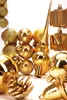 A collection of gold-colored Christmas ornaments and a tree topper. Náhled obrázku produktu