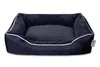 A dark navy dog bed with white trim, shown from a front-facing angle on a white background. Produktbild-Vorschau