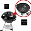 A black charcoal kettle grill with a close-up inset showing the grill grate and a diagram indicating dimensions. Náhľad obrázku produktu