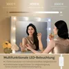 A woman applying makeup in front of a lighted mirror, with text overlays explaining features. Produktbild-Vorschau