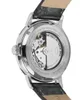 Close-up view of the back of a Timex automatic watch, showing the movement and engraved details on the case back. Voir les images du produit