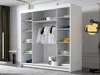 A white wardrobe with shelves and hanging clothes is shown in a room with a dark curtain and a modern lamp. Náhľad obrázku produktu