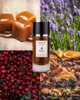 A collage of ingredients and a perfume bottle, suggesting the scent profile of the perfume. Podgląd zdjęcia produktu