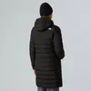 A person wearing a black parka and beanie, viewed from the back. Produktbild-Vorschau