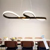 A modern LED pendant light fixture hangs above a dining table set with chairs and place settings. Podgląd zdjęcia produktu