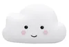 A white cloud-shaped night light with a cute face. Voir les images du produit