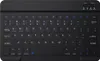 A black portable Bluetooth keyboard is shown from a top-down perspective on a light gray background. Náhled obrázku produktu