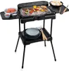 An electric grill with food and accessories on a white background. Produktbild-Vorschau