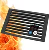 A black metal grate with flames in the background. Produktbild-Vorschau