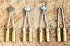 A set of five different metal tips for a wood-burning tool, laid out on a wooden surface. Produktbild-Vorschau