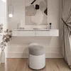 A modern vanity table with a stool in a well-lit room. Produktbild-Vorschau