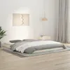 A bedroom scene with a low-profile bed frame and bedding. Náhled obrázku produktu
