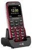 A red Doro Primo mobile phone is shown in its charging dock against a white background. Náhľad obrázku produktu