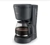 A black Philips coffee maker with a glass carafe filled with coffee, set against a white background. Produktbild-Vorschau
