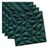 Four dark green 3D wall panels are arranged in a staggered, overlapping manner against a white background. Podgląd zdjęcia produktu