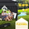 A family is enjoying a day outdoors under a black canopy tent, with a lake and trees in the background. Náhľad obrázku produktu