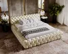 A luxurious bedroom scene featuring a tufted beige bed. Náhľad obrázku produktu